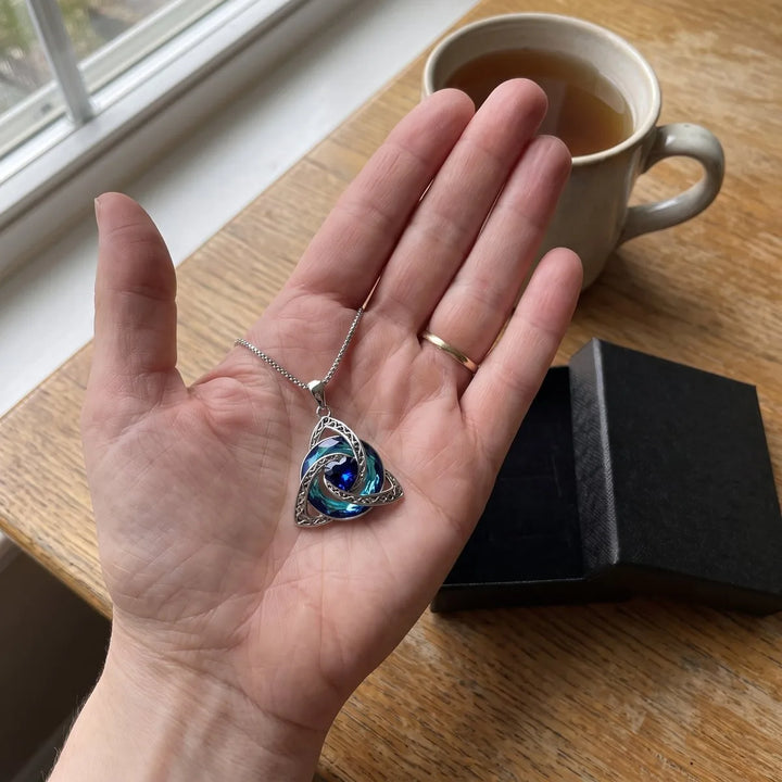 The pendant in an open palm