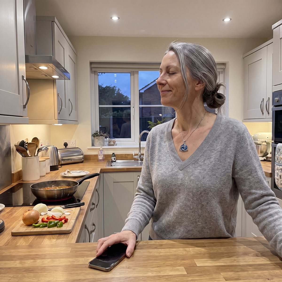 A woman putting her phone down after a call